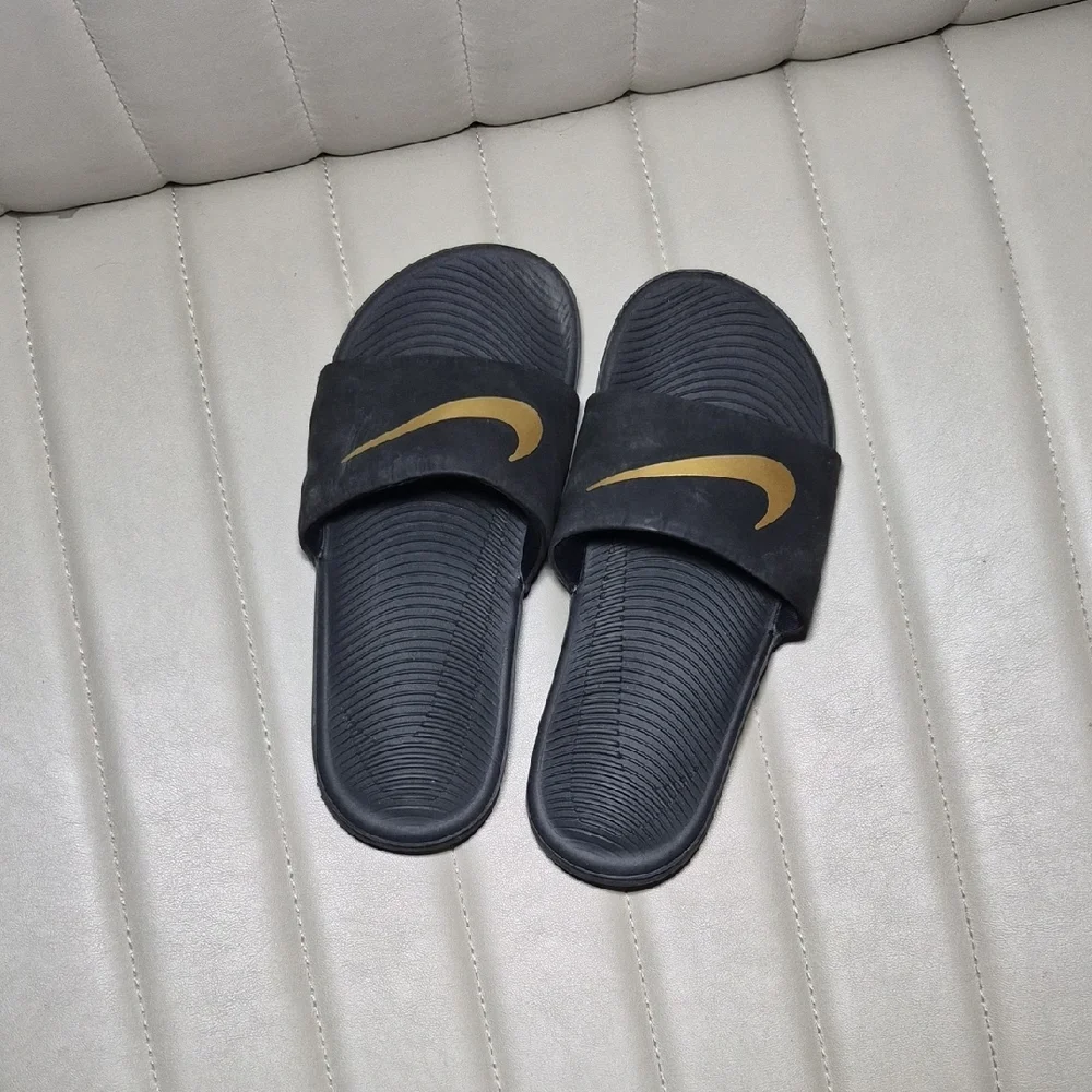 Nike Black Slides with Gold Swoosh 2Y